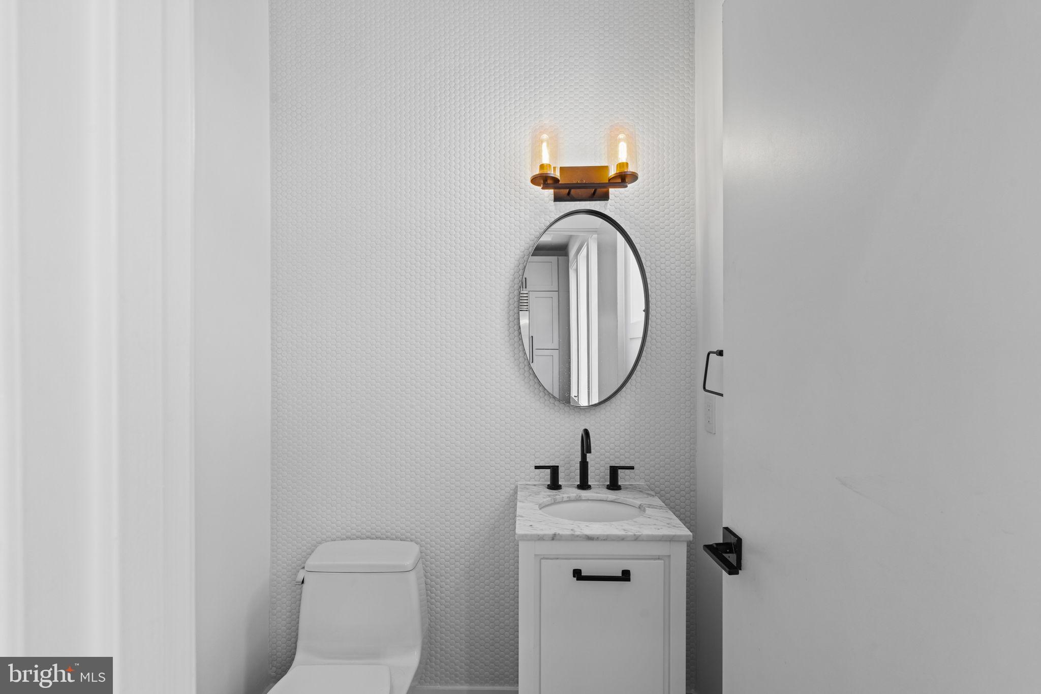 742 South Broad Street Philadelphia, PA 19146 - Photo 14 of 41 a bathroom with a toilet and a sink