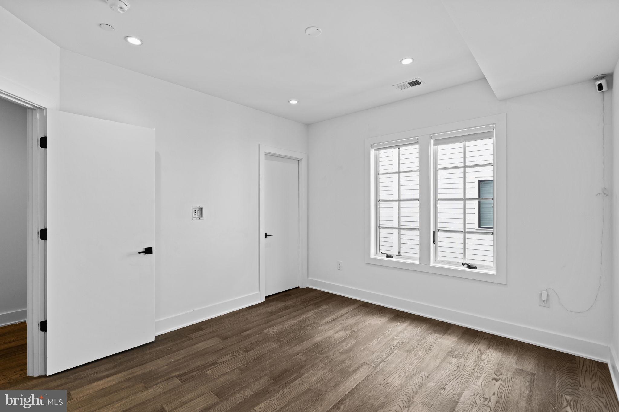 742 South Broad Street Philadelphia, PA 19146 - Photo 25 of 41 a view of an empty room with wooden floor and a window