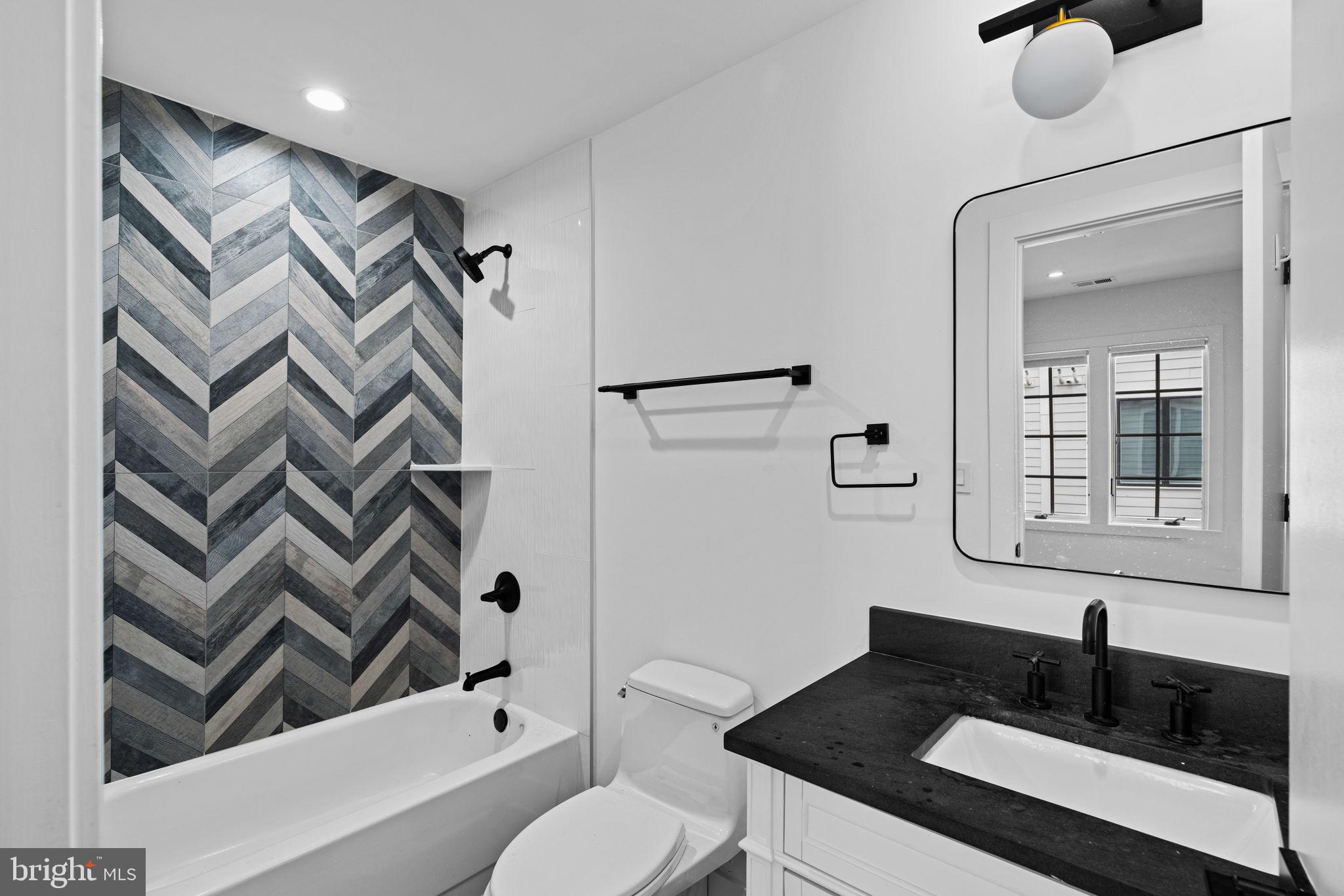 742 South Broad Street Philadelphia, PA 19146 - Photo 27 of 41 a bathroom with a granite countertop sink toilet and shower