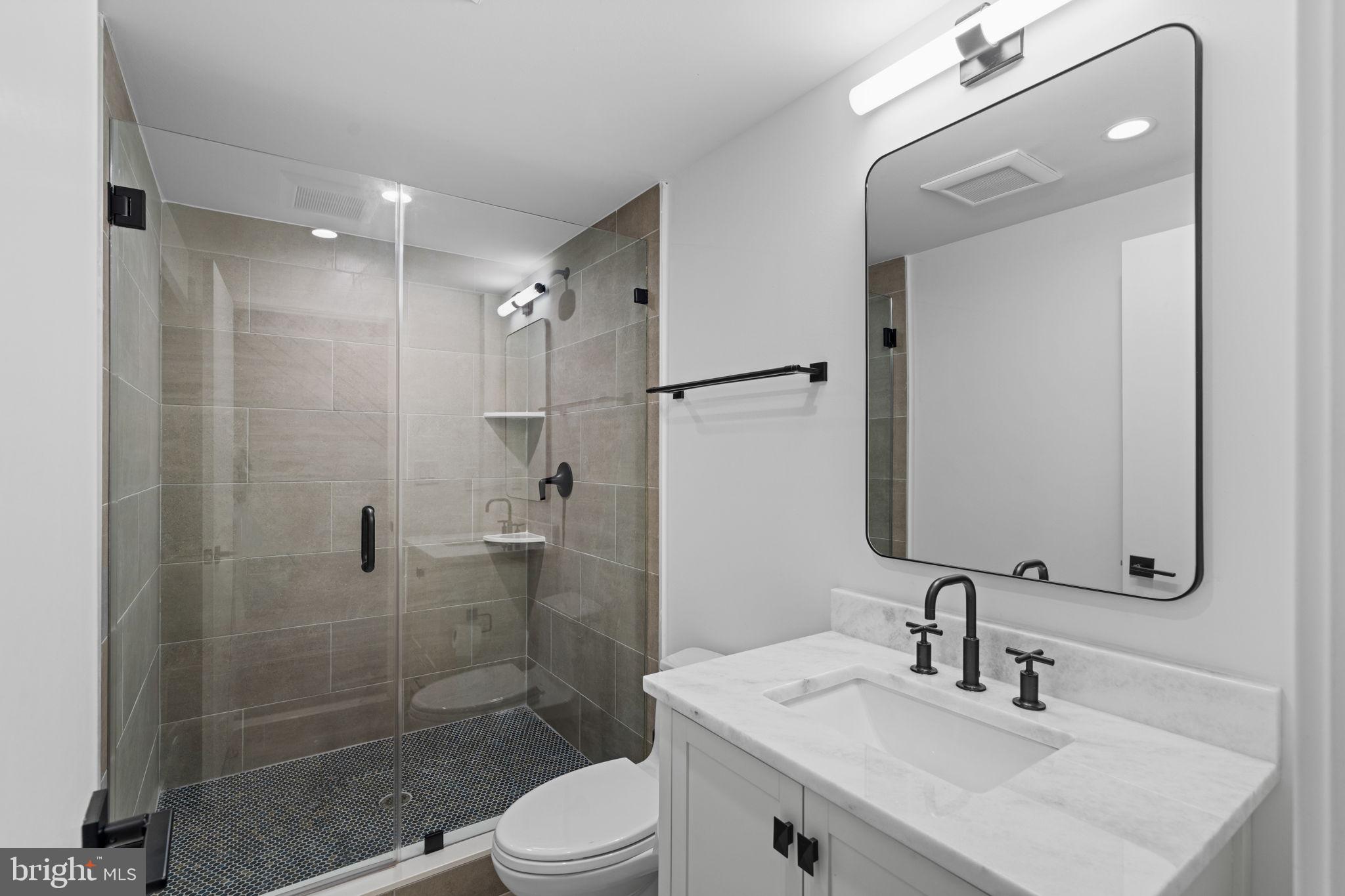 742 South Broad Street Philadelphia, PA 19146 - Photo 40 of 41 a bathroom with a sink toilet and shower