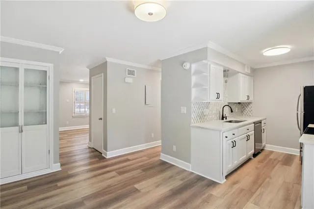 a view of a kitchen with electric appliances