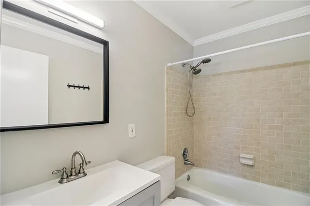 a bathroom with a sink a toilet and a bathtub