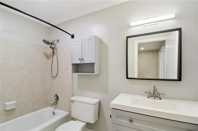 a bathroom with a toilet a sink and a bathtub