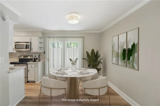 a dining room with furniture and window