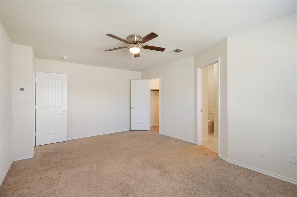 910 Amber Street Princeton, TX 75407 - Photo 13 of 24 a view of a big room with carpet
