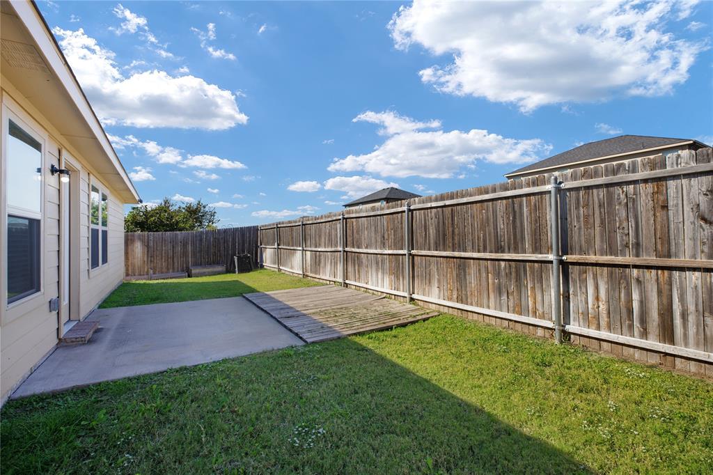 910 Amber Street Princeton, TX 75407 - Photo 21 of 24 a view of backyard with green space