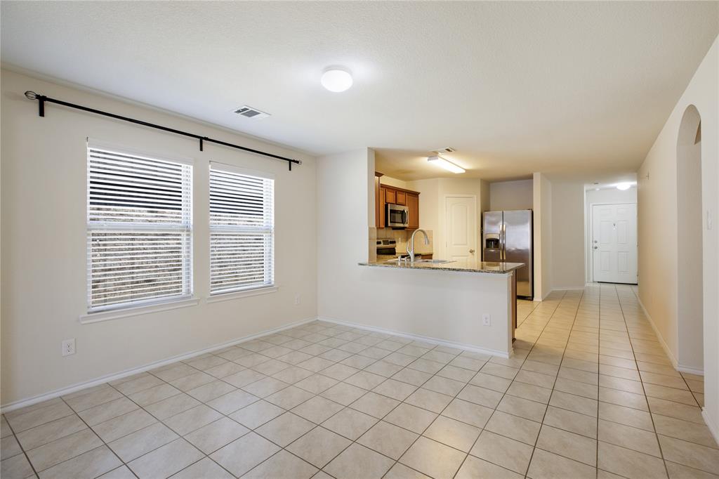 910 Amber Street Princeton, TX 75407 - Photo 7 of 24 a view of an empty room and window