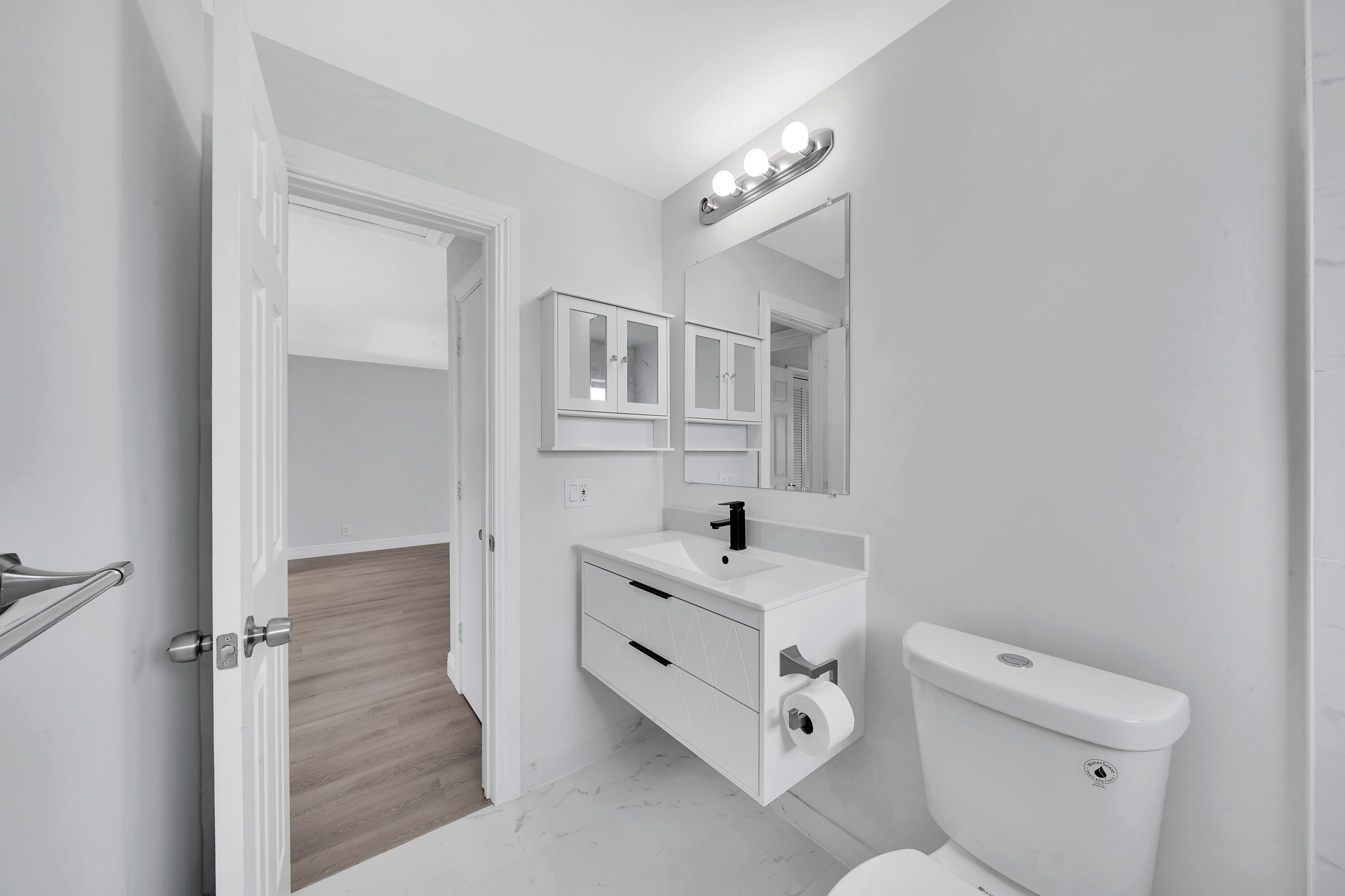 104 Palamino Circle Boca Raton, FL 33487 - Photo 21 of 34 a bathroom with a sink a toilet and shower