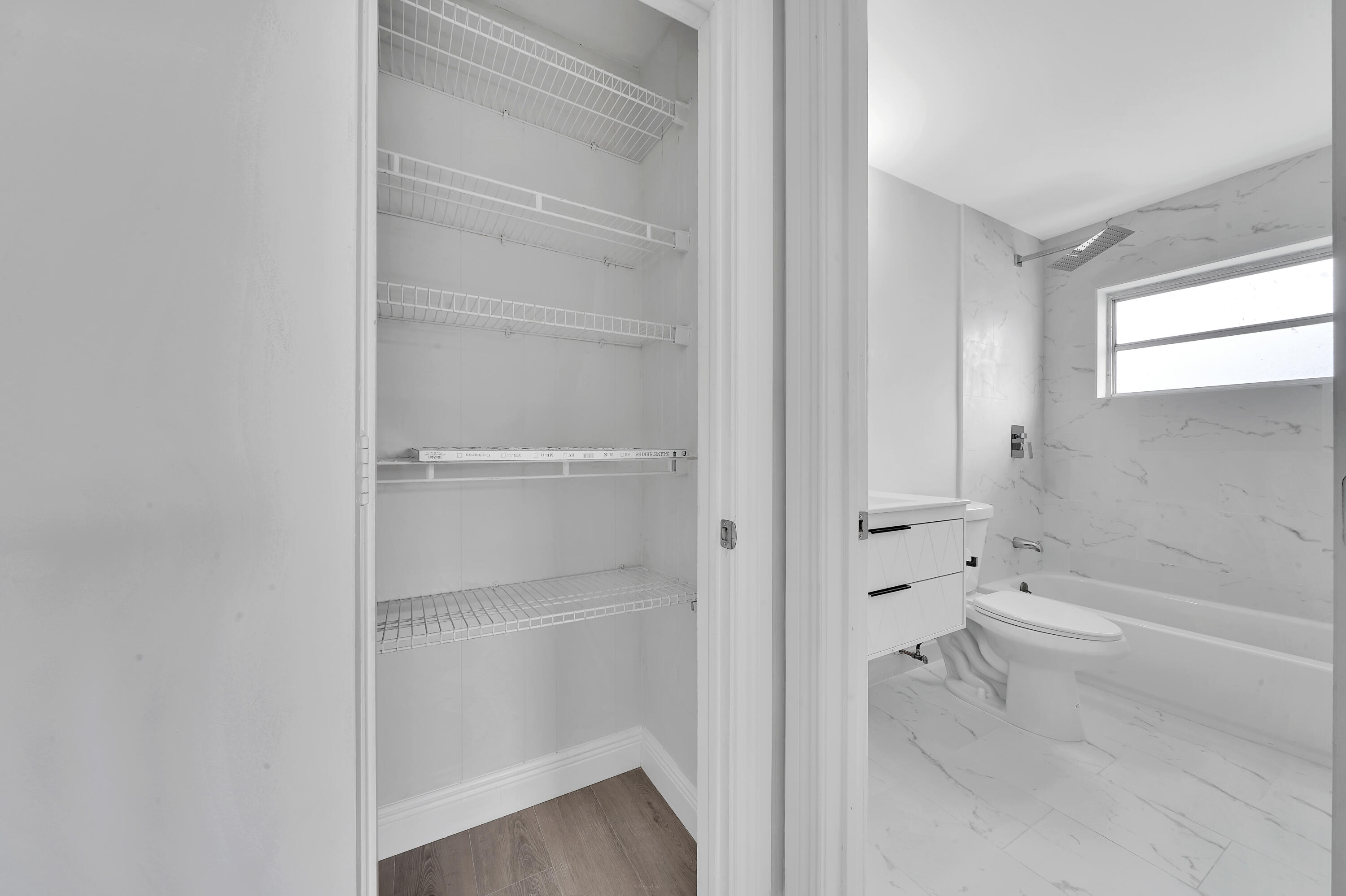 104 Palamino Circle Boca Raton, FL 33487 - Photo 22 of 34 a bathroom with a bathtub and a shower