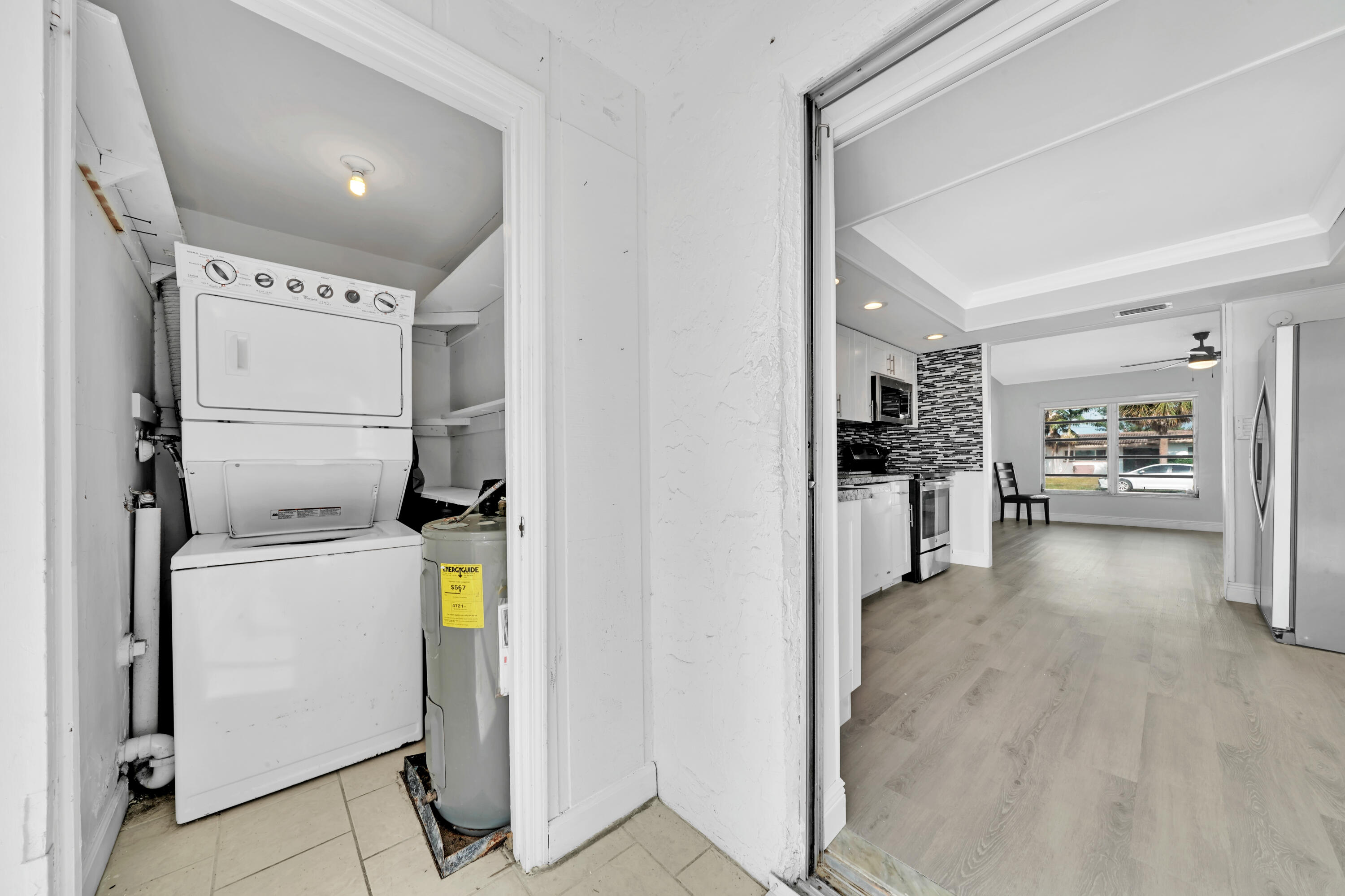 104 Palamino Circle Boca Raton, FL 33487 - Photo 25 of 34 a view of a storage & utility room with washer and dryer