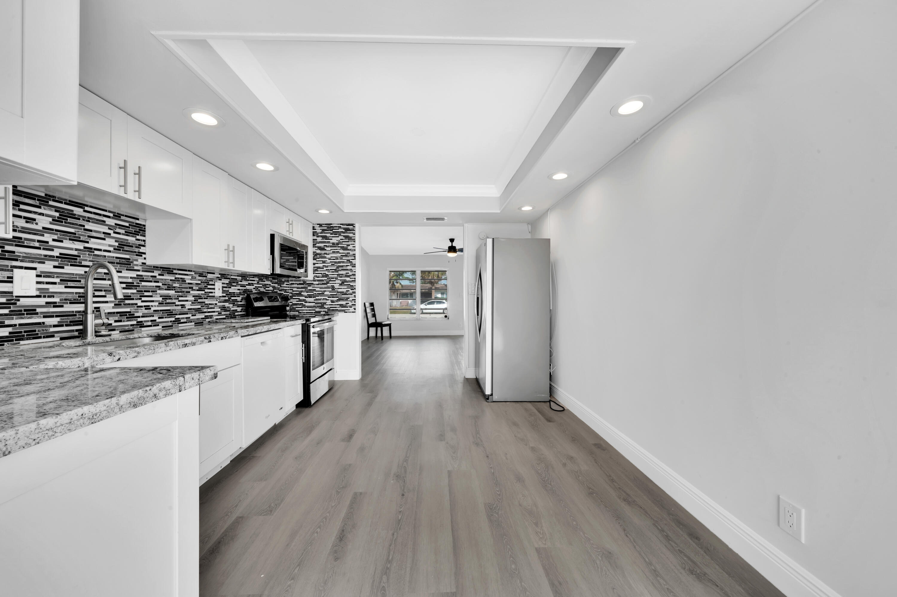 104 Palamino Circle Boca Raton, FL 33487 - Photo 5 of 34 a view of kitchen with wooden floor