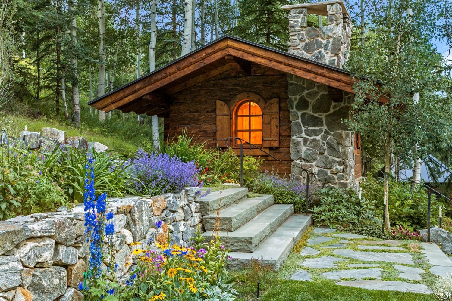 424 West Forest Road Vail, CO 81657 - Photo 14 of 17 a front view of a house with a yard