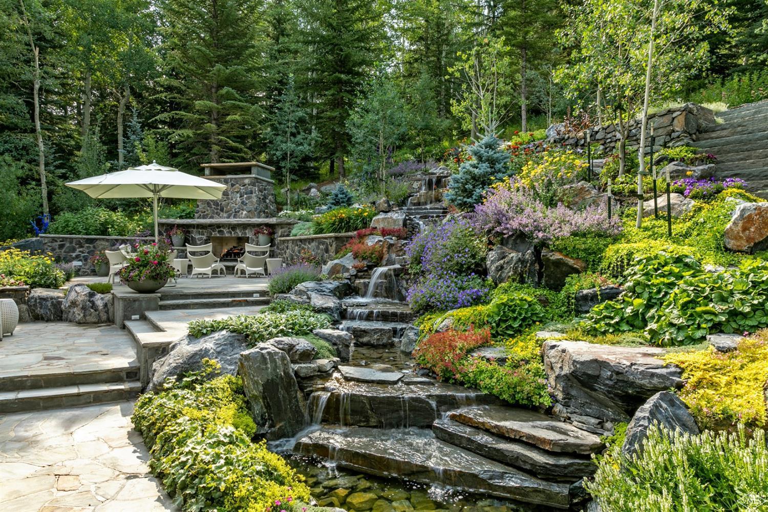 424 West Forest Road Vail, CO 81657 - Photo 15 of 17 a backyard of a house with lots of green space
