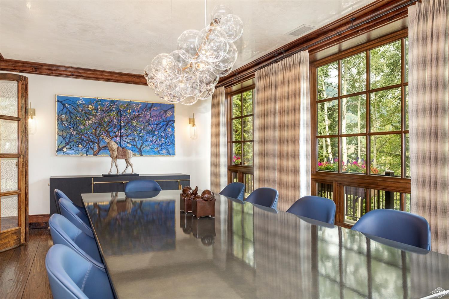 424 West Forest Road Vail, CO 81657 - Photo 5 of 17 a living room with furniture and a large window