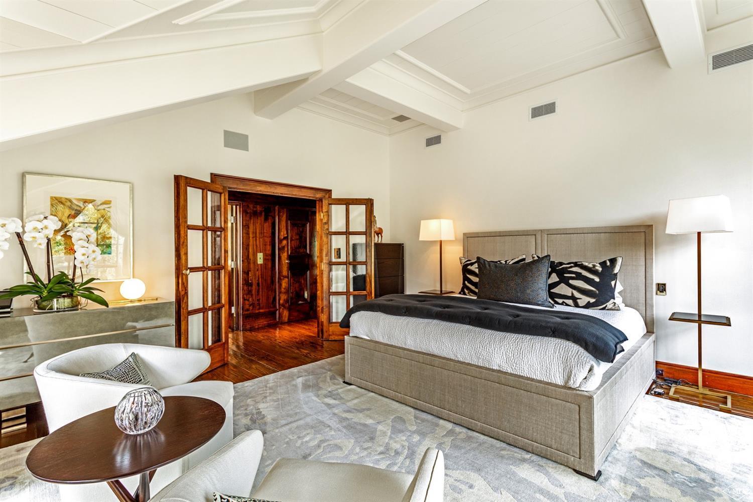 424 West Forest Road Vail, CO 81657 - Photo 6 of 17 a spacious bedroom with a bed and couch