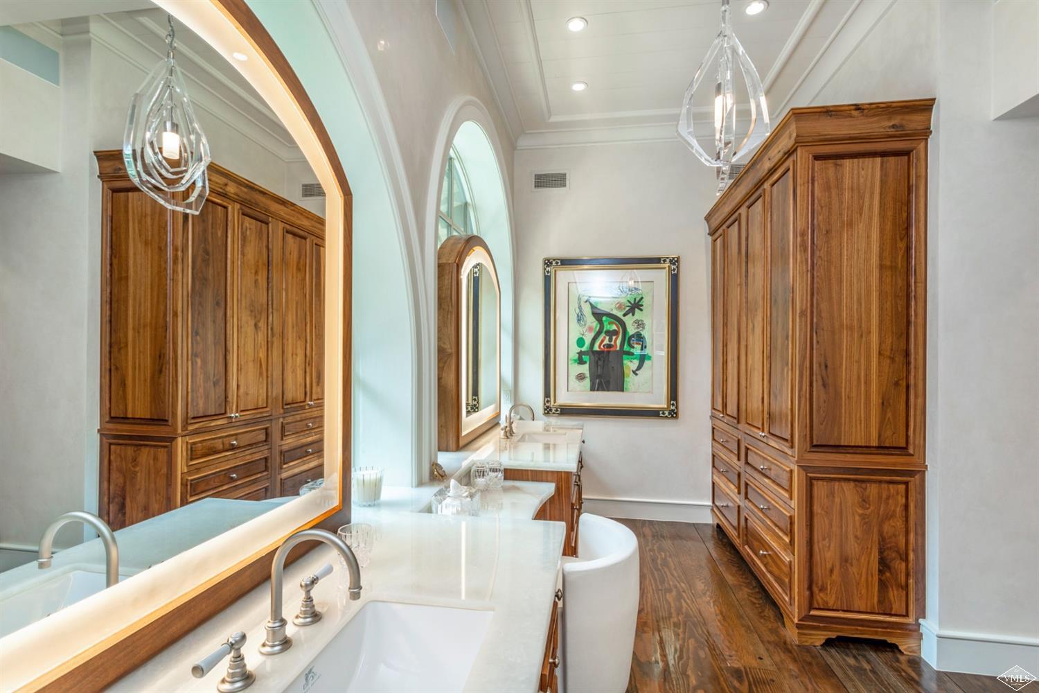424 West Forest Road Vail, CO 81657 - Photo 8 of 17 a bathroom with double vanity sink a mirror and a bathtub