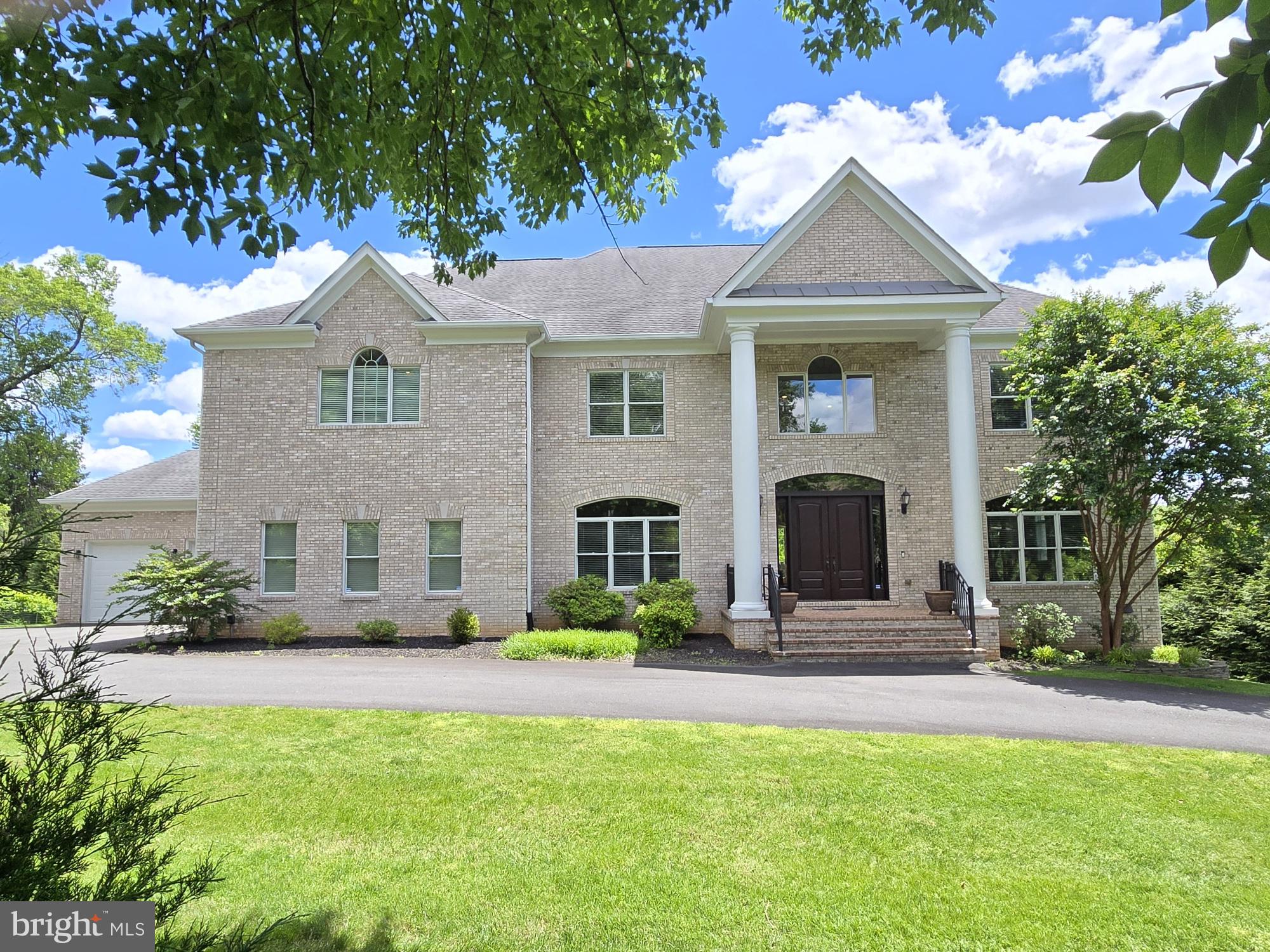 10405 Marbury Road Oakton, VA 22124 - Photo 2 of 72 a front view of a house with garden