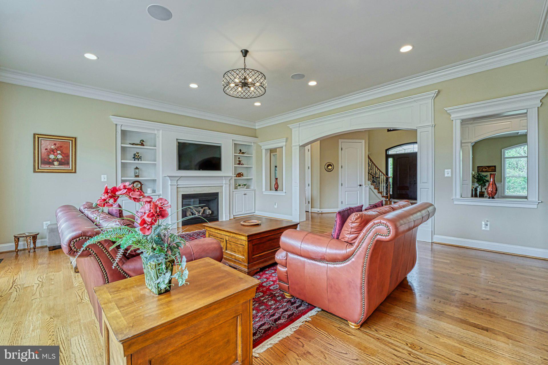 10405 Marbury Road Oakton, VA 22124 - Photo 21 of 72 a living room with furniture fireplace and potted plants