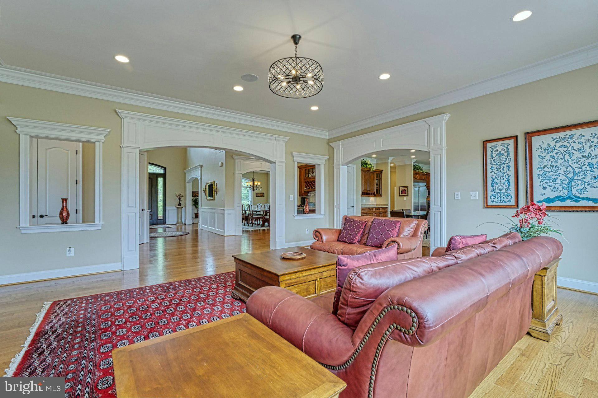 10405 Marbury Road Oakton, VA 22124 - Photo 22 of 72 a living room with furniture chandelier and a table