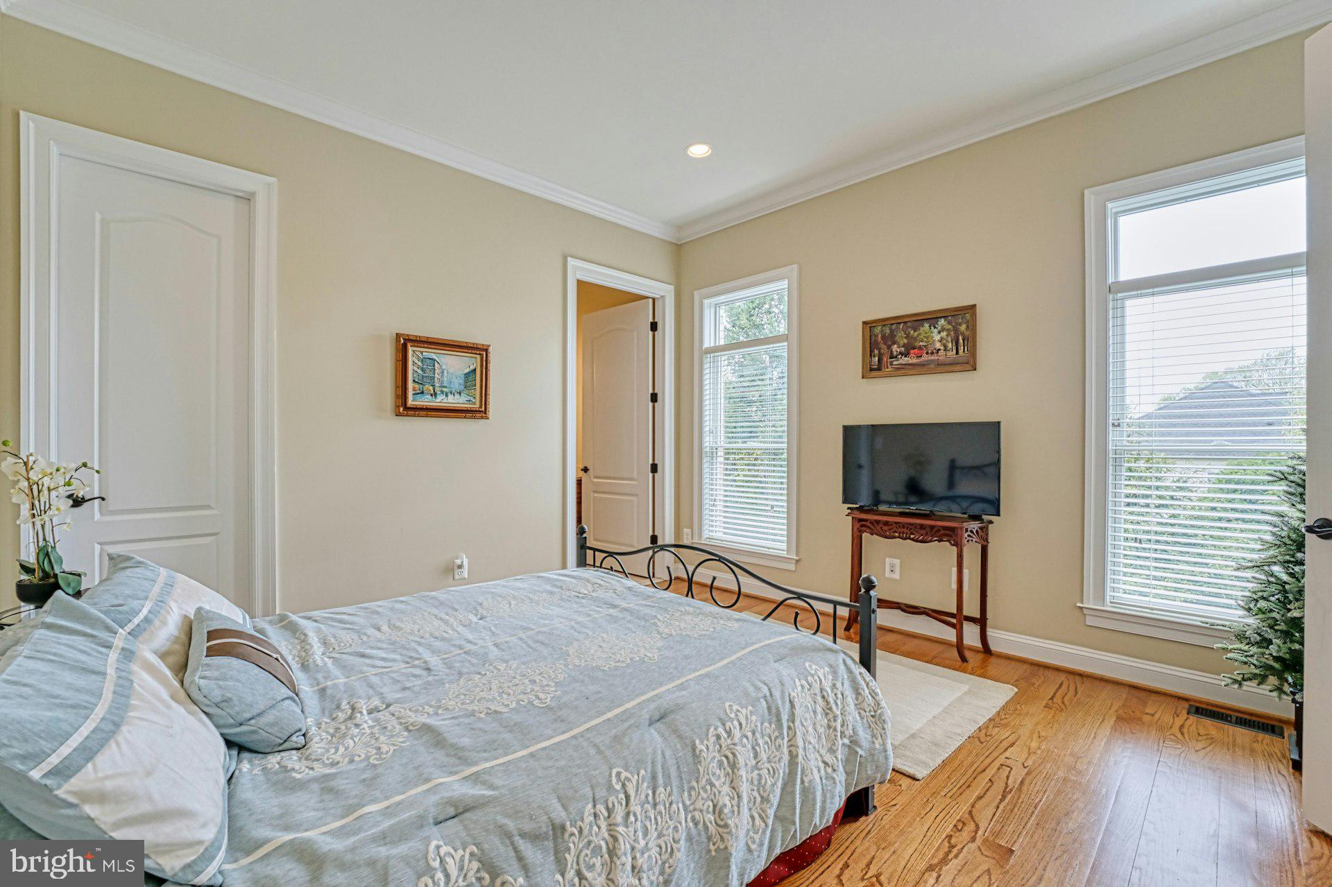 10405 Marbury Road Oakton, VA 22124 - Photo 23 of 72 a bedroom with a bed and a flat screen tv