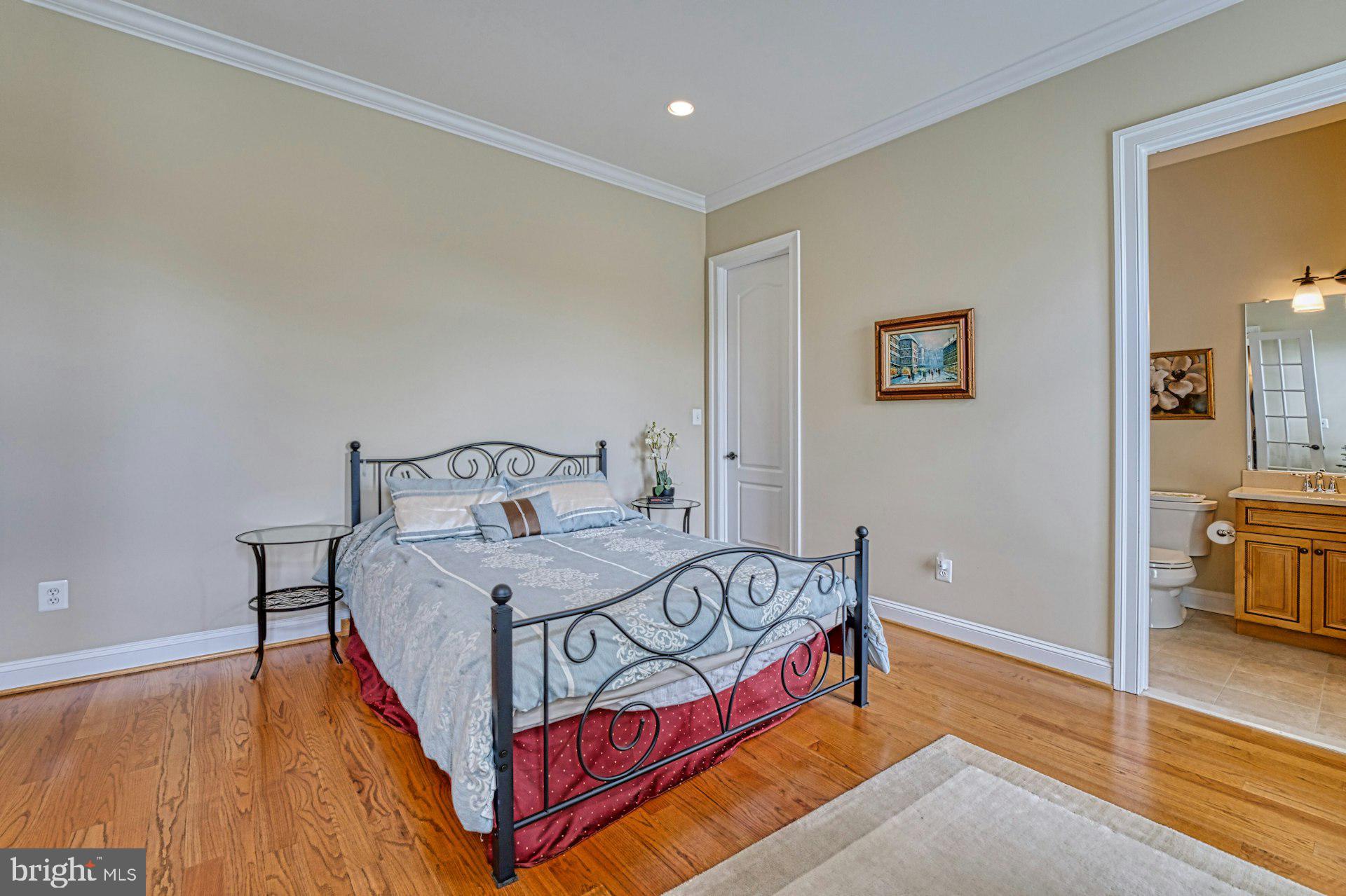 10405 Marbury Road Oakton, VA 22124 - Photo 24 of 72 a bedroom with a bed and a table in it