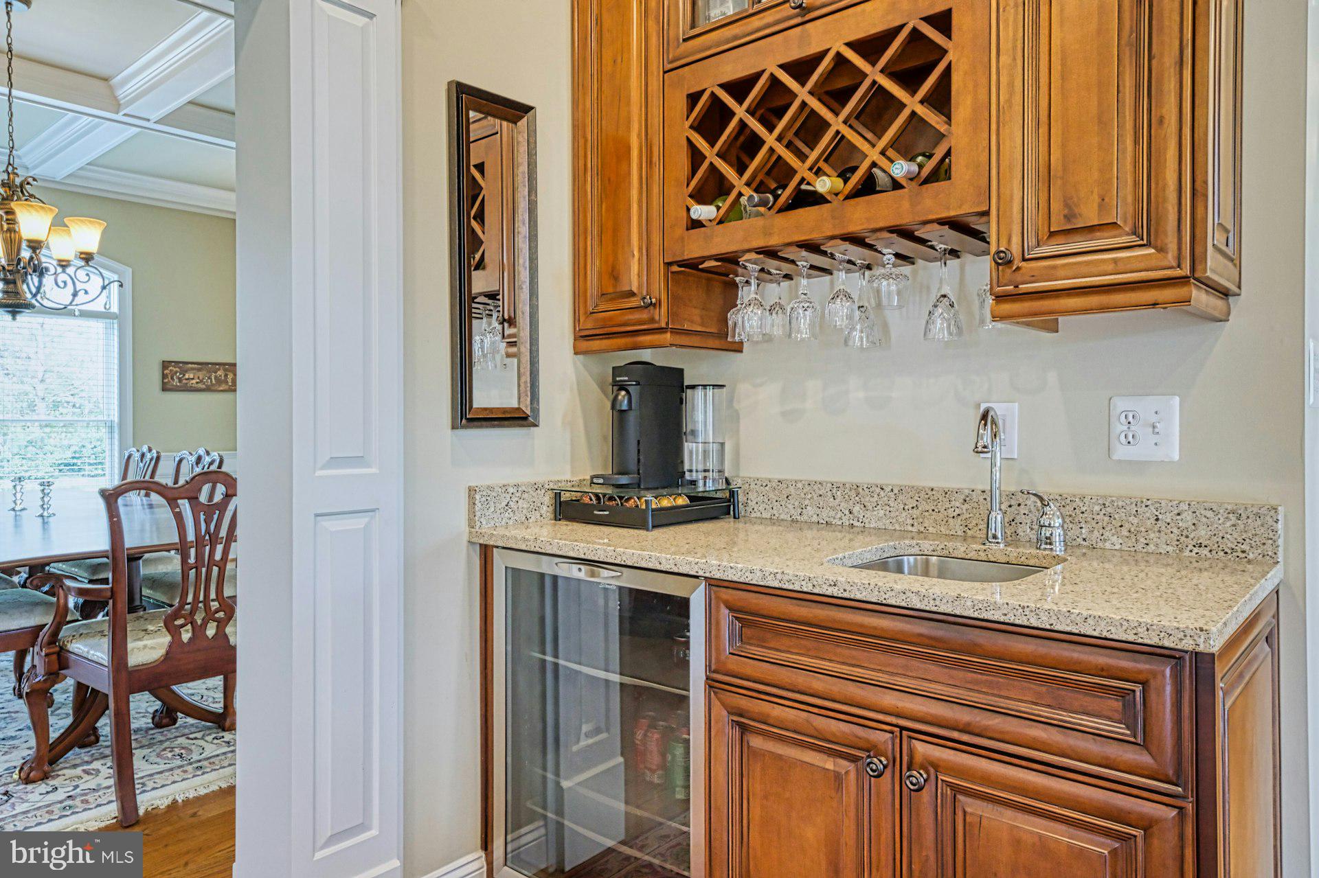 10405 Marbury Road Oakton, VA 22124 - Photo 26 of 72 a kitchen with a sink cabinets and a wooden floor