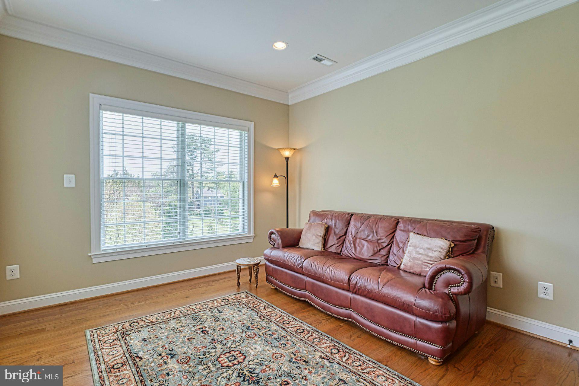 10405 Marbury Road Oakton, VA 22124 - Photo 35 of 72 Sitting Area with Crown Molding & Recessed Lights