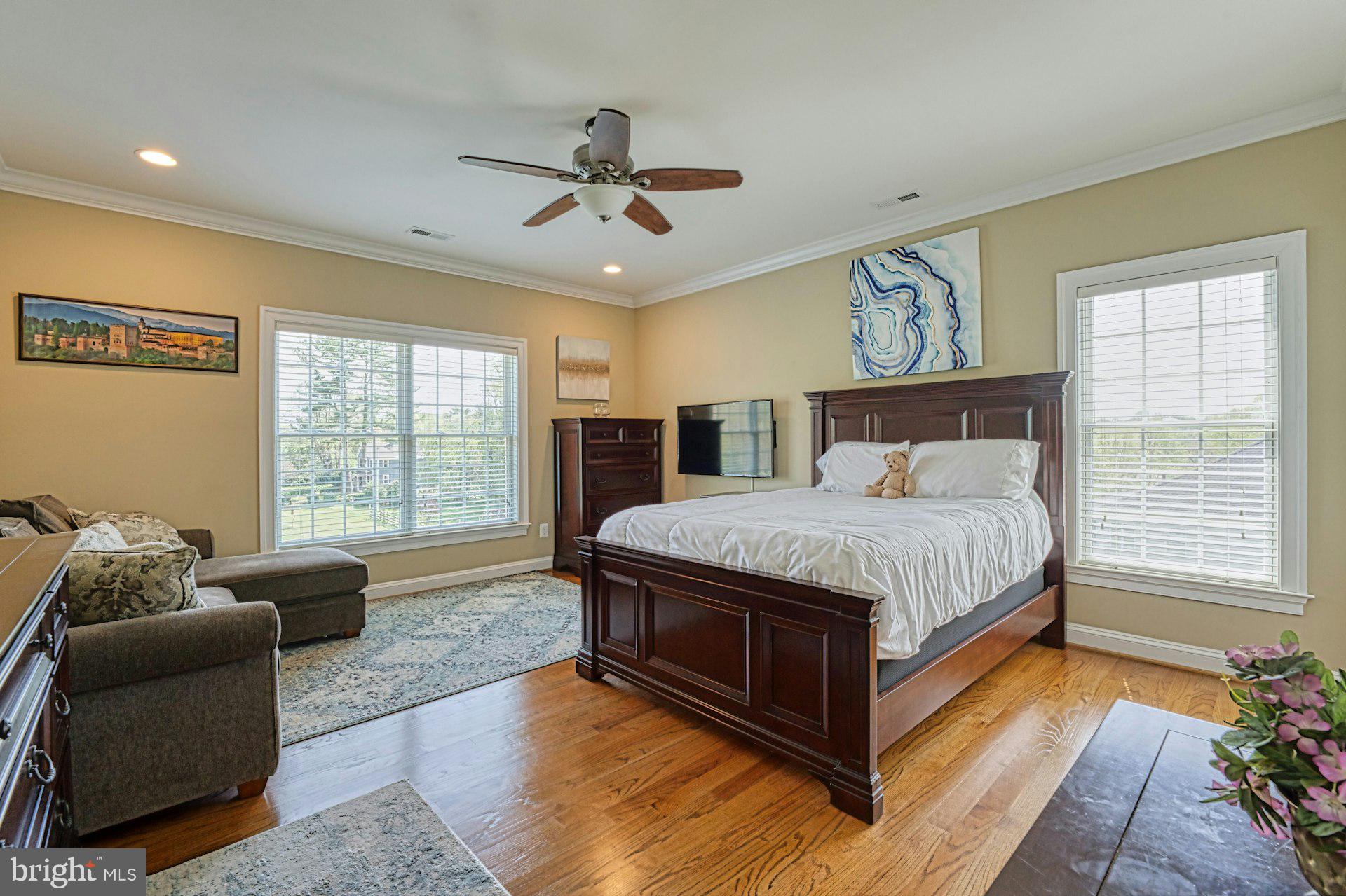 10405 Marbury Road Oakton, VA 22124 - Photo 41 of 72 a spacious bedroom with a bed and glass window