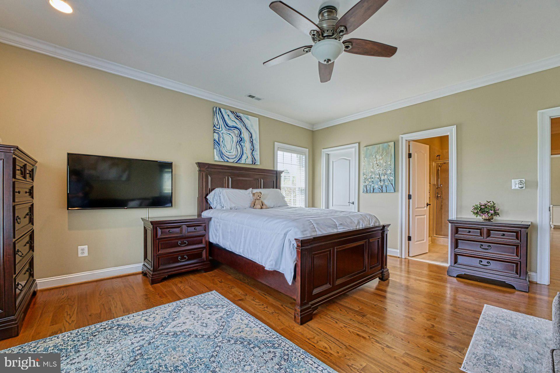 10405 Marbury Road Oakton, VA 22124 - Photo 42 of 72 a bedroom with a bed and flat screen tv