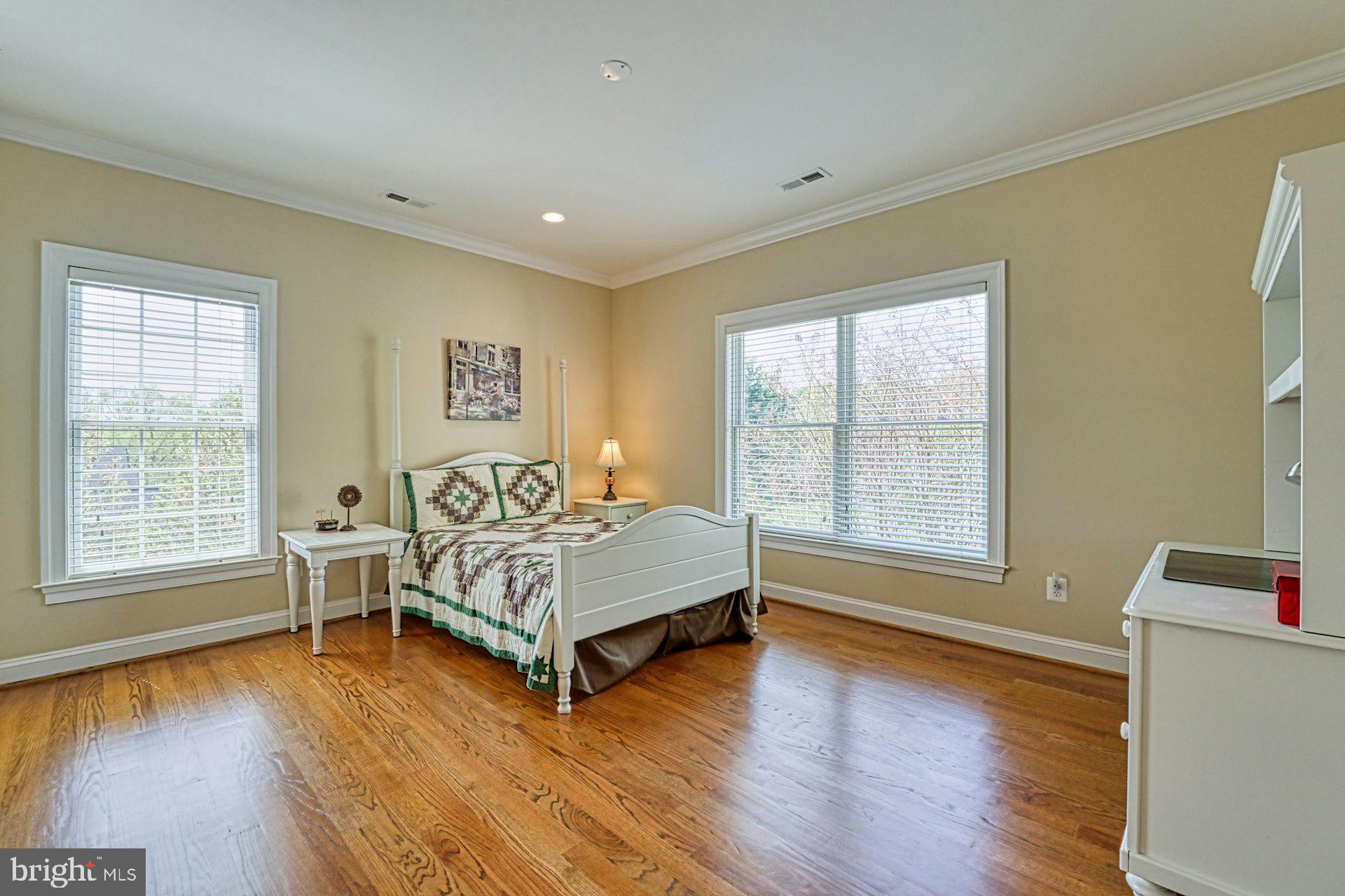 10405 Marbury Road Oakton, VA 22124 - Photo 44 of 72 a spacious bedroom with a bed and a window