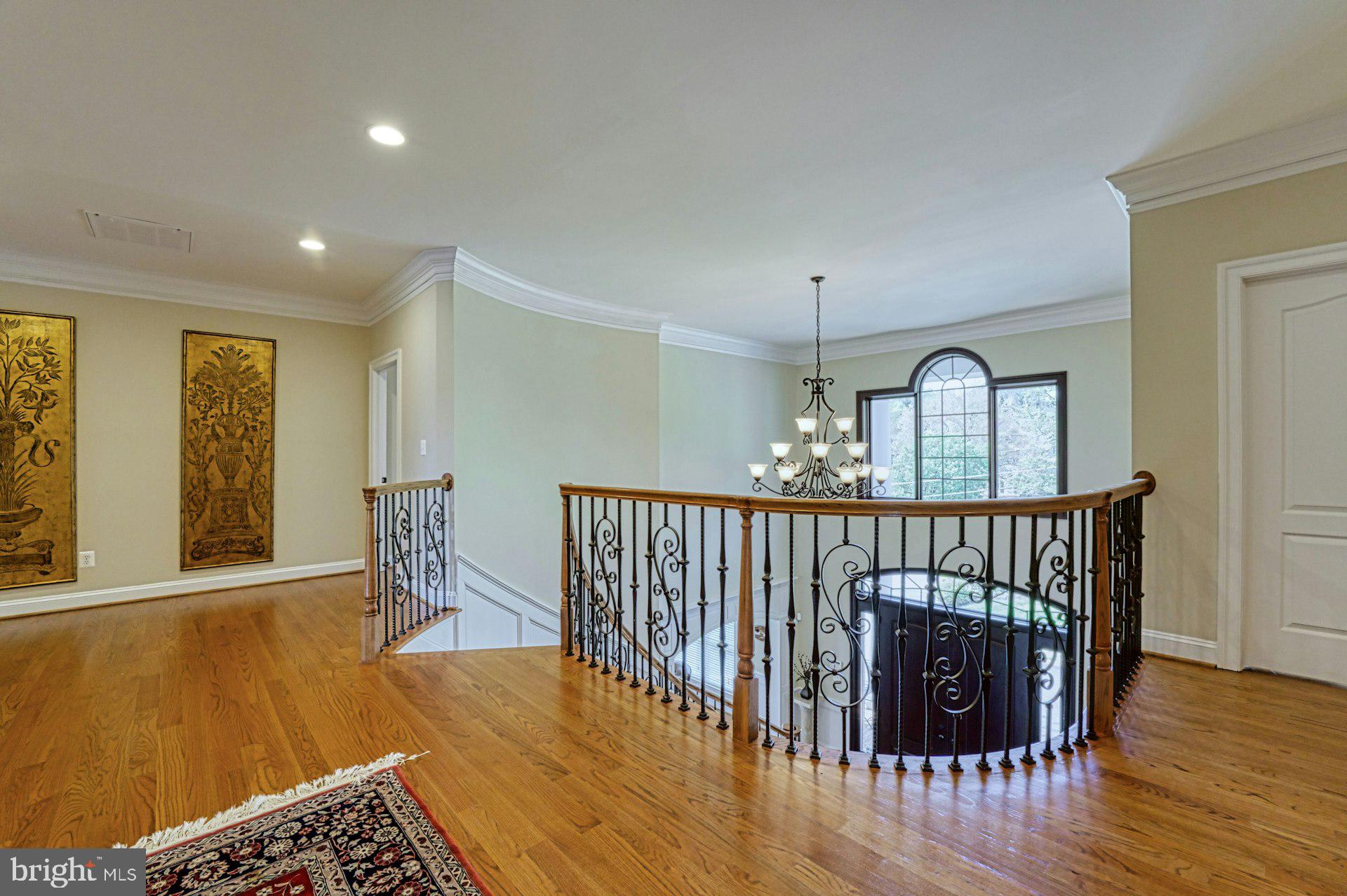 10405 Marbury Road Oakton, VA 22124 - Photo 48 of 72 a view of a hallway with wooden floor windows and entryway