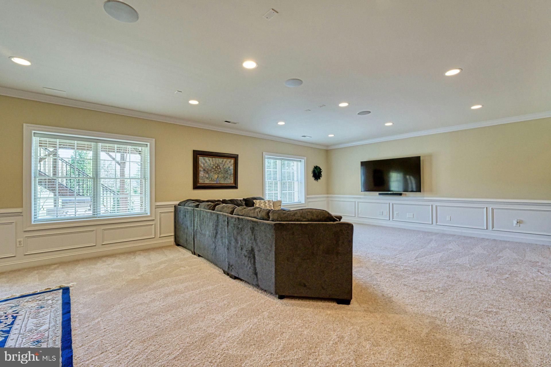 10405 Marbury Road Oakton, VA 22124 - Photo 49 of 72 a living room with furniture and a flat screen tv