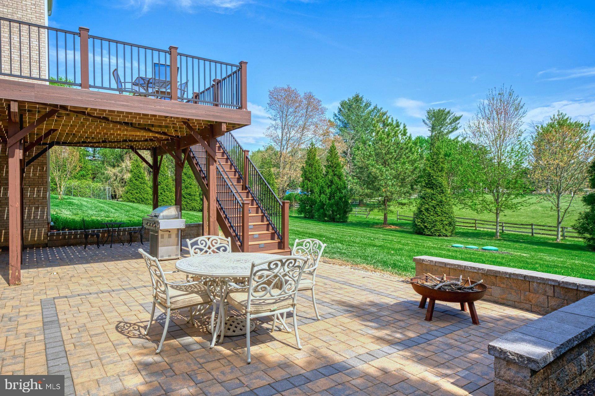 10405 Marbury Road Oakton, VA 22124 - Photo 60 of 72 a view of a patio with a table chairs and a yard