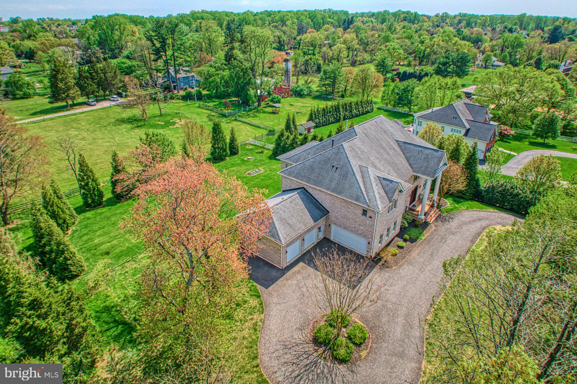 10405 Marbury Road Oakton, VA 22124 - Photo 66 of 72 an aerial view of a house with a garden and lake view