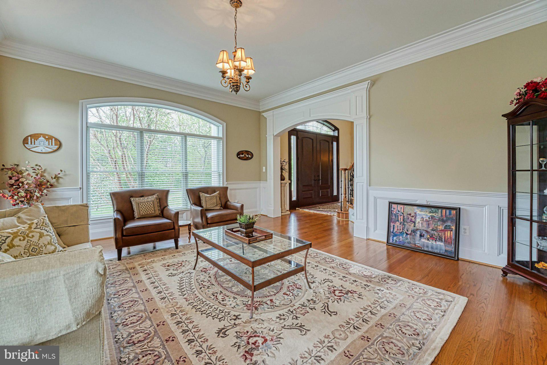 10405 Marbury Road Oakton, VA 22124 - Photo 7 of 72 a living room with furniture and a chandelier