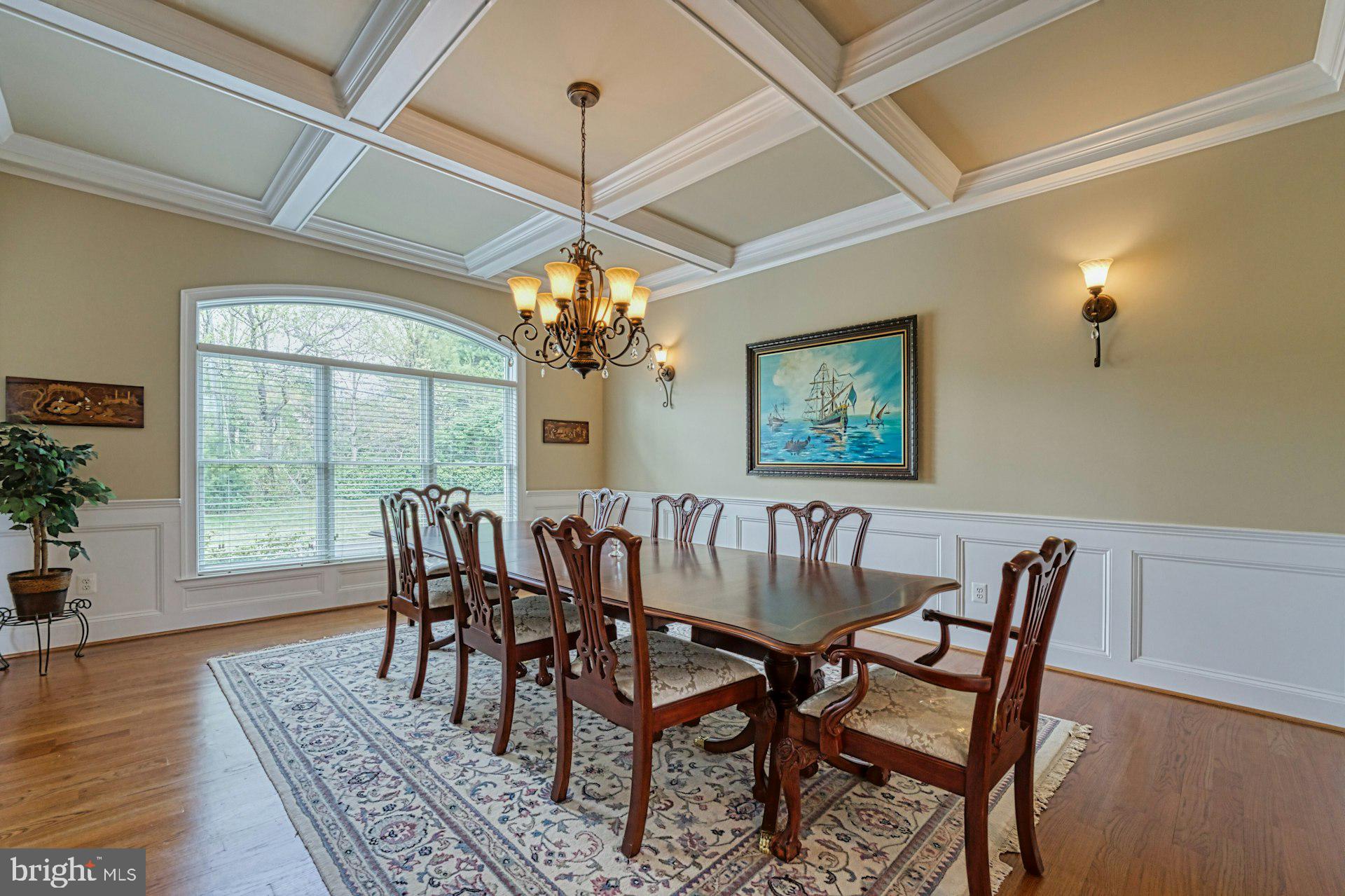 10405 Marbury Road Oakton, VA 22124 - Photo 8 of 72 a view of a dining room with furniture a chandelier and wooden floor