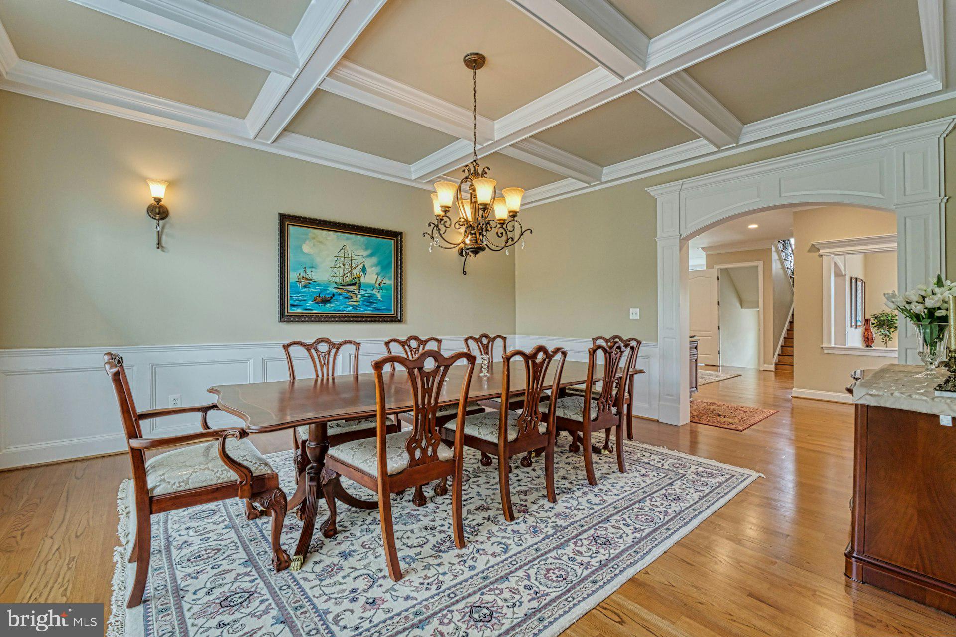 10405 Marbury Road Oakton, VA 22124 - Photo 10 of 72 a dining room with furniture a rug and a chandelier