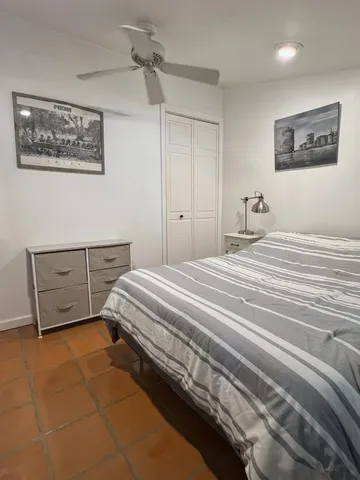 a bedroom with a bed and a cabinets