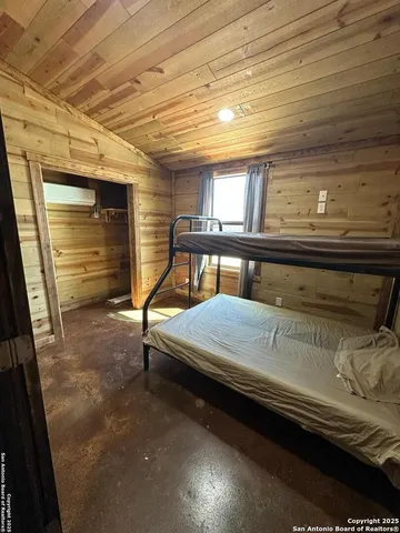 a bedroom with a bed and a walk in closet