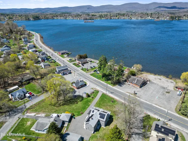 an aerial view of a house with a lake view