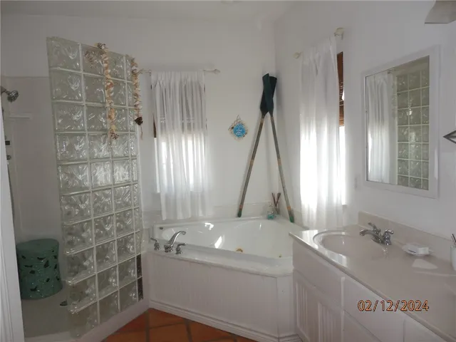 a bedroom with a bed and a wall painting