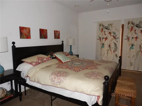 a bedroom with a bed and a dresser