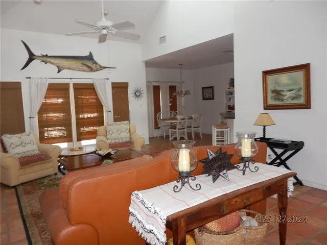 a view of a livingroom with furniture and entryway