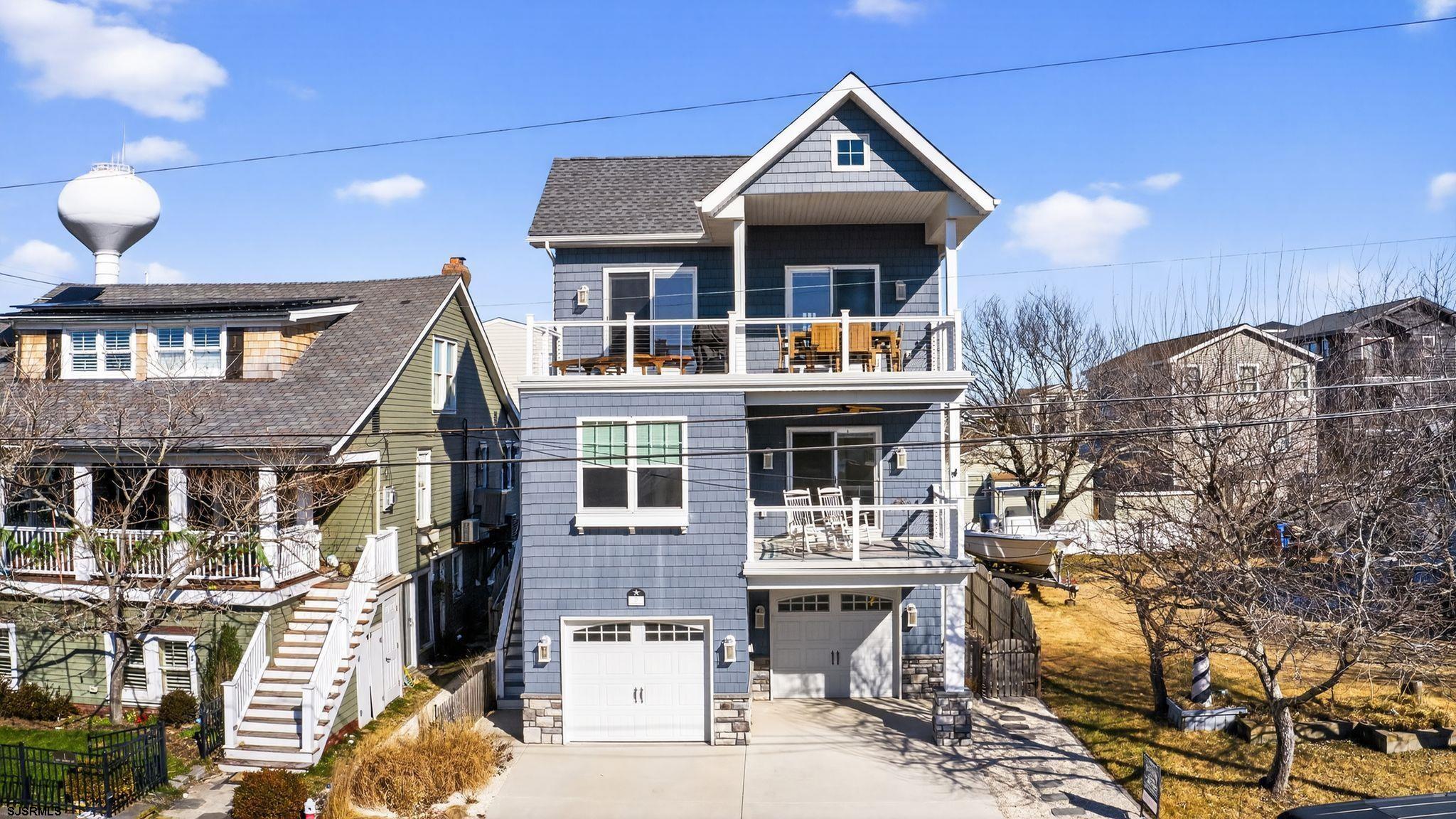 a front view of a house with yard porch and furniture