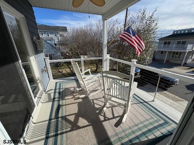 5 East Sumner Avenue Strathmere, NJ 08248 - Photo 21 of 31 a balcony with table and chairs