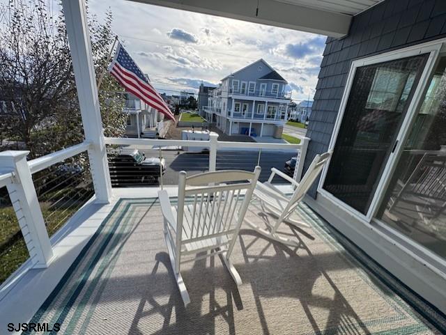 5 East Sumner Avenue Strathmere, NJ 08248 - Photo 23 of 31 a balcony with furniture