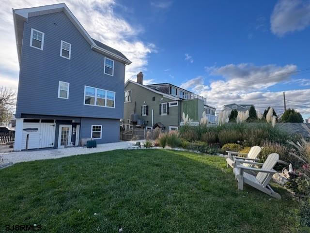 5 East Sumner Avenue Strathmere, NJ 08248 - Photo 28 of 31 a backyard of a house with table and chairs