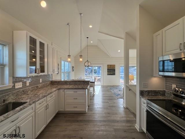 5 East Sumner Avenue Strathmere, NJ 08248 - Photo 4 of 31 a large kitchen with granite countertop a stove top oven a sink a counter space and cabinets