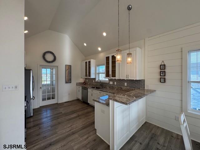 5 East Sumner Avenue Strathmere, NJ 08248 - Photo 7 of 31 a kitchen with stainless steel appliances granite countertop a sink stove and wooden floor