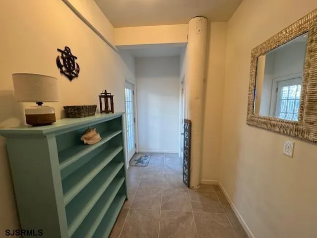 a view of hallway with washer and dryer